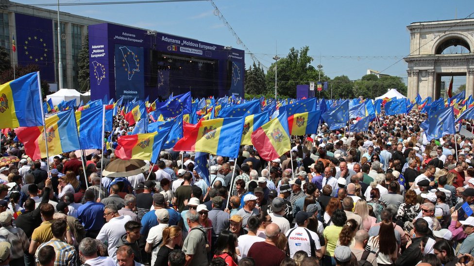 Moldovans wave EU flags during a pro-European rally in Chisinau on Sunday