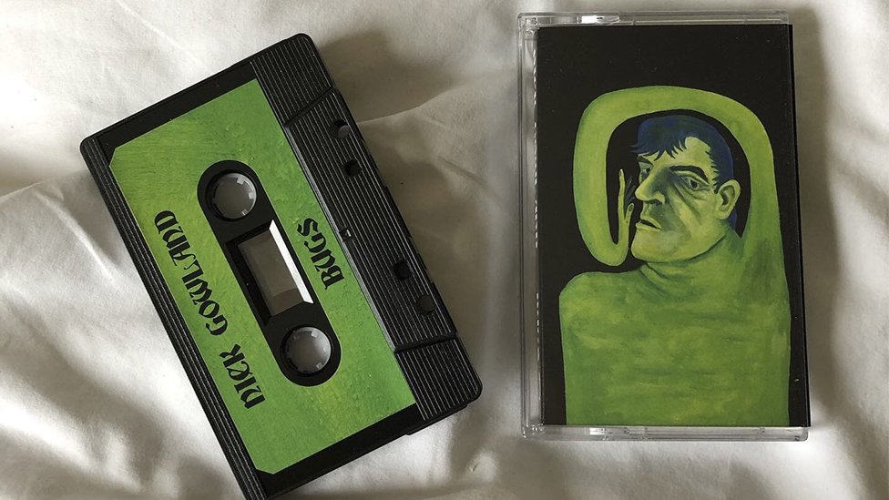 A green cassette tape