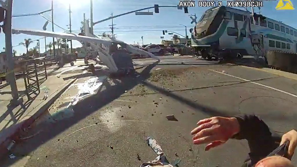 Near-miss for pilot saved from downed plane hit by train