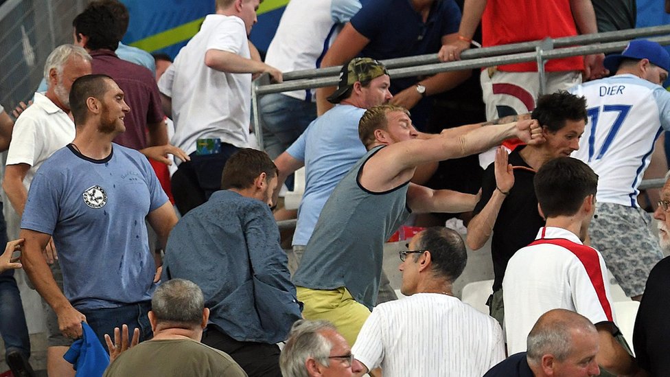 Supporters clash in the stands at Stade Velodrome in Marseille