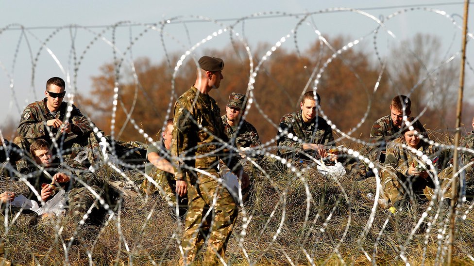 The Slovenian army build the barbed wire barrier on the border between Slovenia and Croatia
