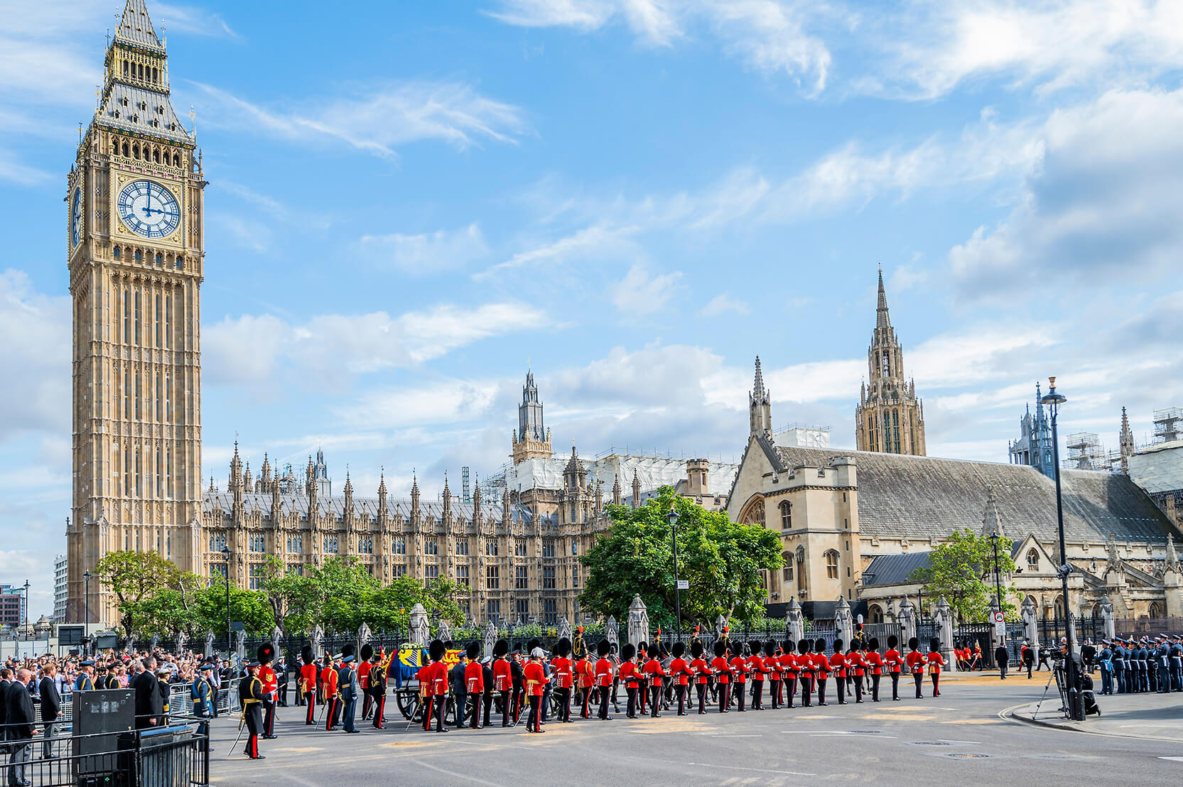 The procession passing Big Ben and the Palace of Westminster