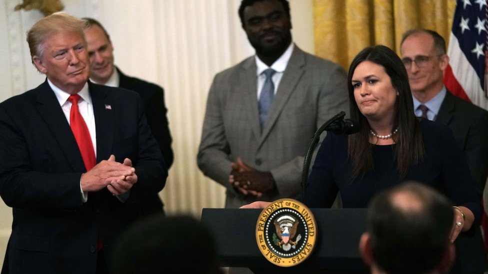 Trump y Sarah Sanders.