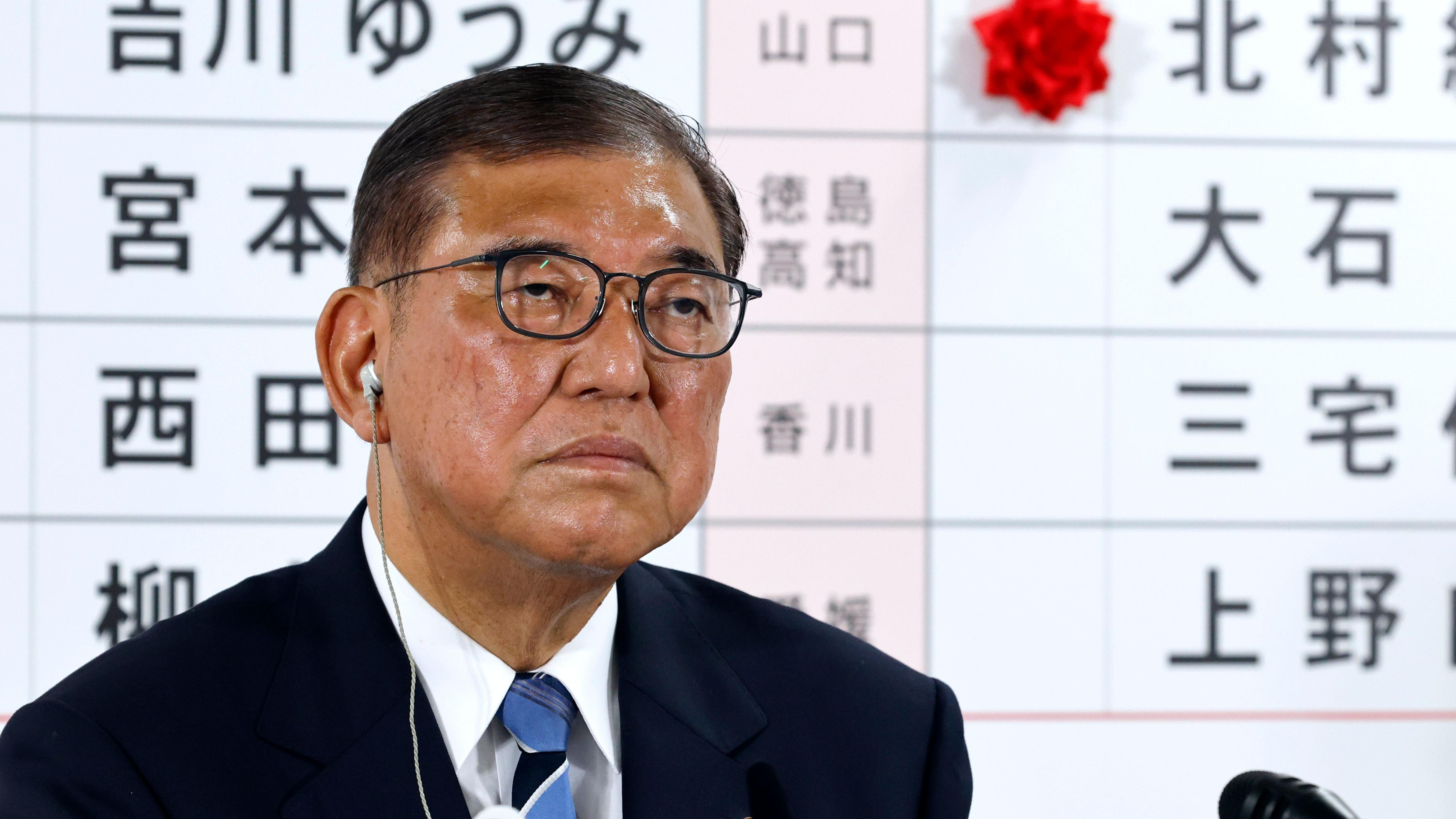 Japan election: PM vows to stay on despite bruising election loss