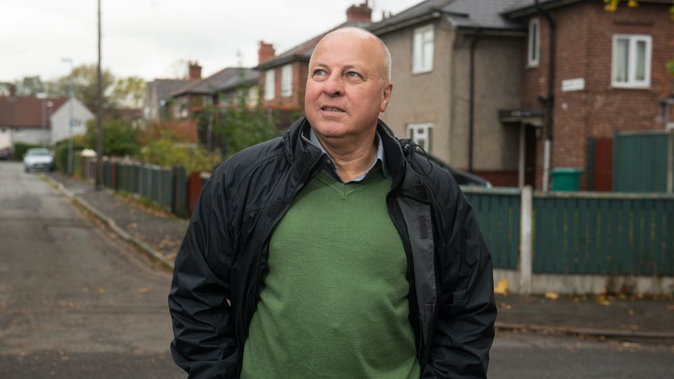 Eamonn, who still lives in north-west England, revisiting one of his former streets in Manchester