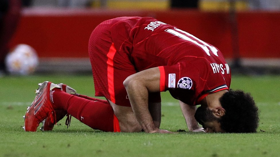Mohamed Salah celebrates a goal by prostrating in prayer on the pitch