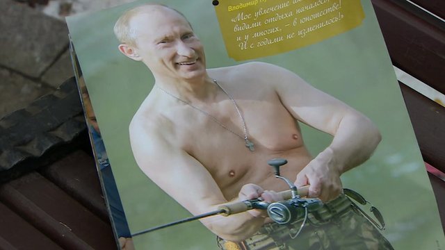 Putin, bare-chested holding his fishing rod - a calendar image