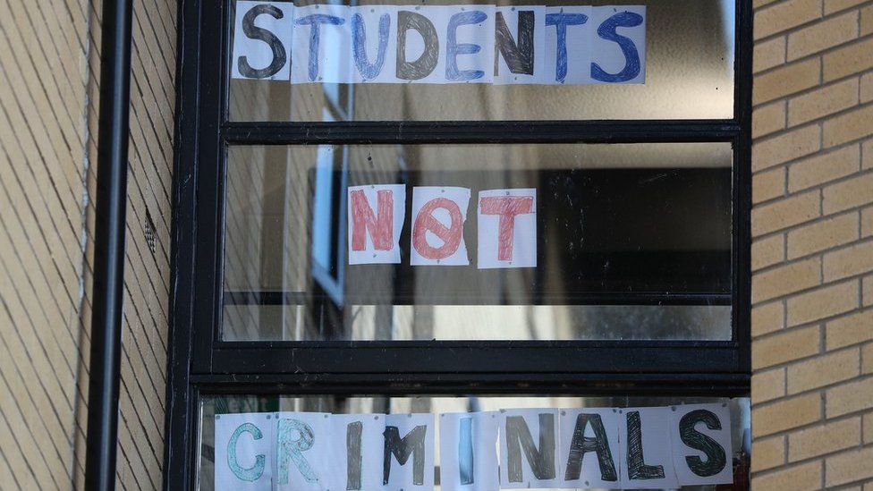 A sign reading "students not criminals" at Murano Street Student Village in Glasgow