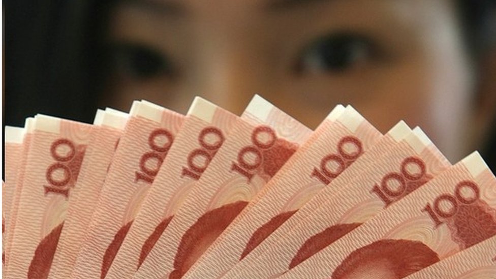 Mainland China 100 Yuan notes are at a Bank of China in Hong Kong 12 January 2007.