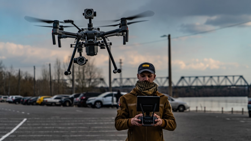 a man flying a drone