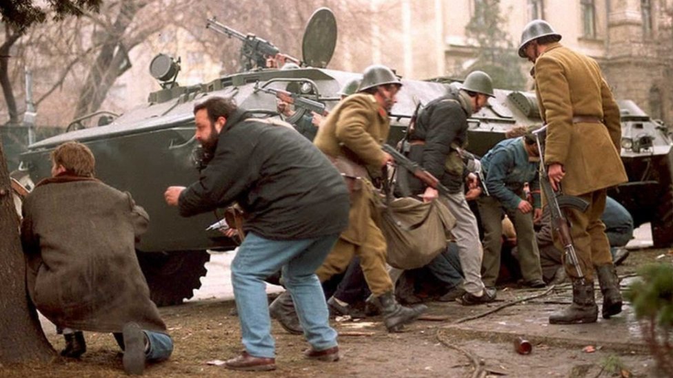 Romanian troops and civilians hide from snipers in downtown Bucharest - 24 December 1989