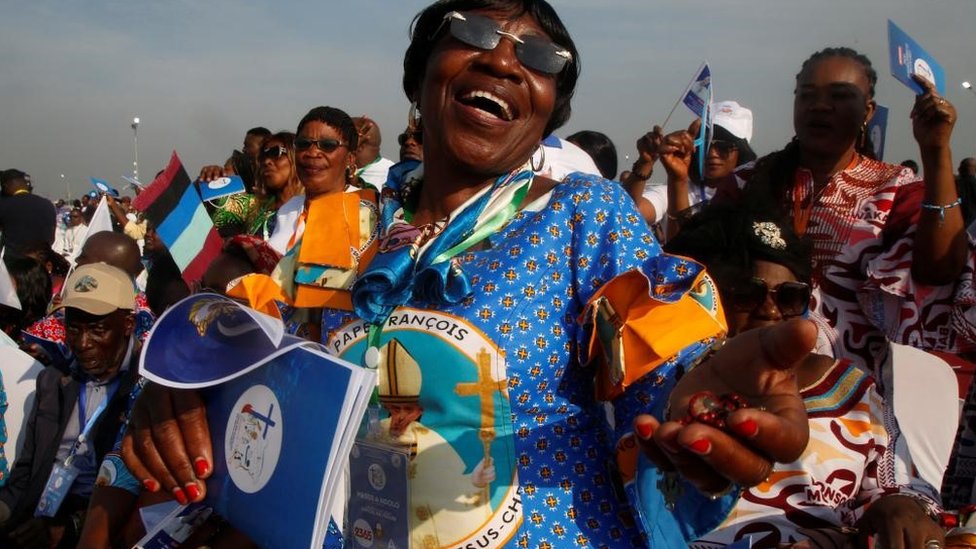 Woman dancing at Pope's mass