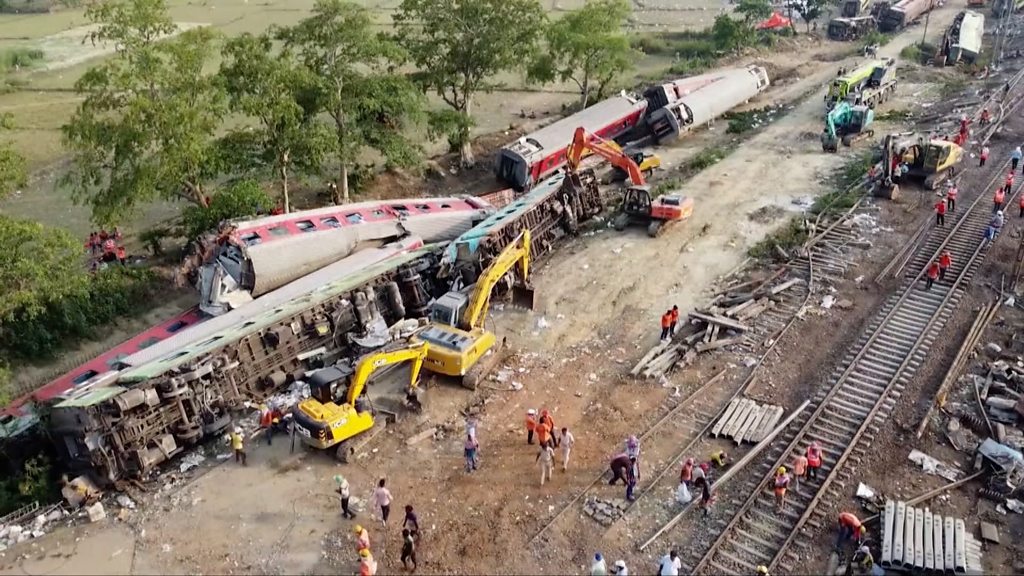 India train accident: Workers remove wreckage from tracks