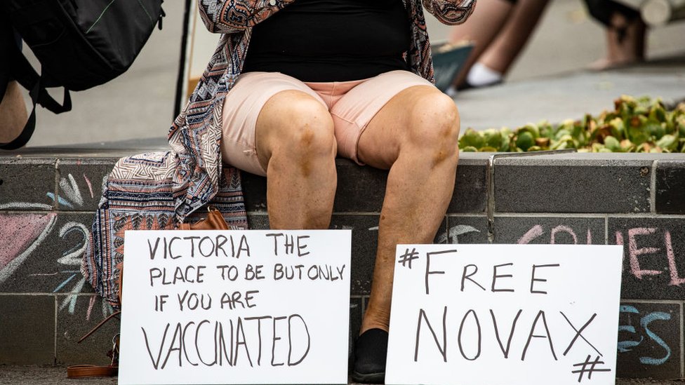 signs saying "Free Novax" - a play on the tennis star's name