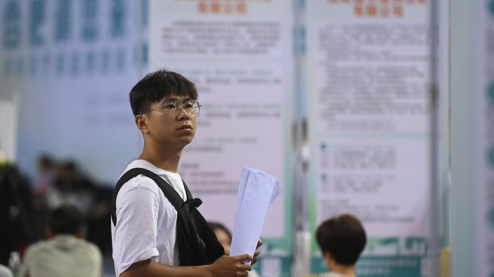 Candidates look for employment opportunities at a job fair on August 9, 2023 in Hefei, Anhui Province of China