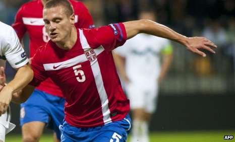 Manchester United defender Nemanja Vidic and scored twice for his country