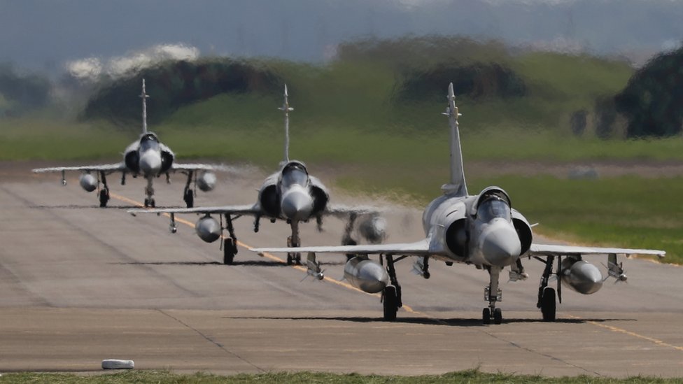 Three Taiwanese Air Force Mirage 2000-5 fighter jets taxi on the runway before take off at an airbase in Hsinchu, Taiwan, 07 August 2022.