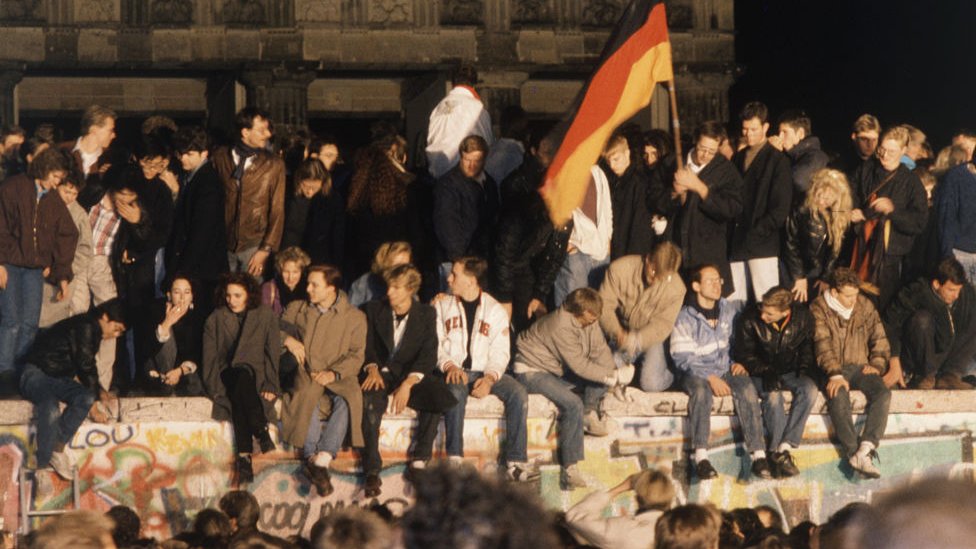 Revellers celebrate the opening of the Berlin Wall
