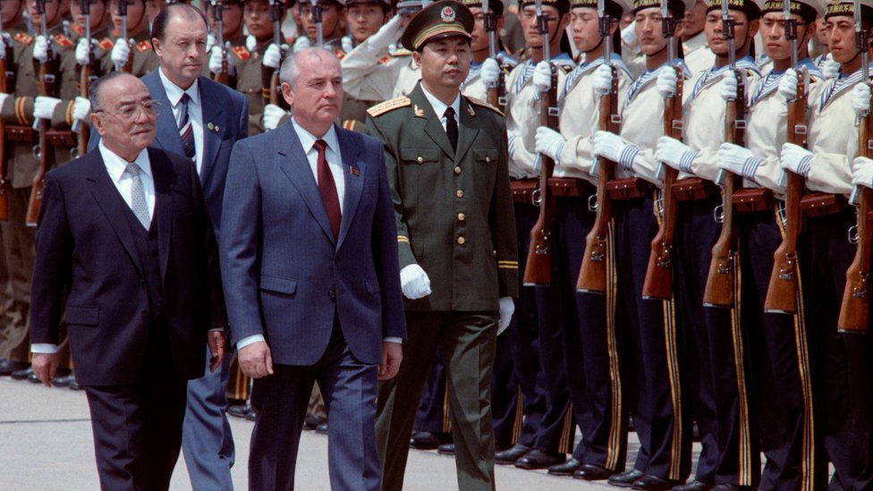 General Secretary of the Soviet Communist Party, Mikhail Gorbachev (2nd R) review the People's Liberation Army (PLA) troops along with Chinese president Yang Shangkun (L) during the welcoming ceremony at Beijing Airport on May 15, 1989.