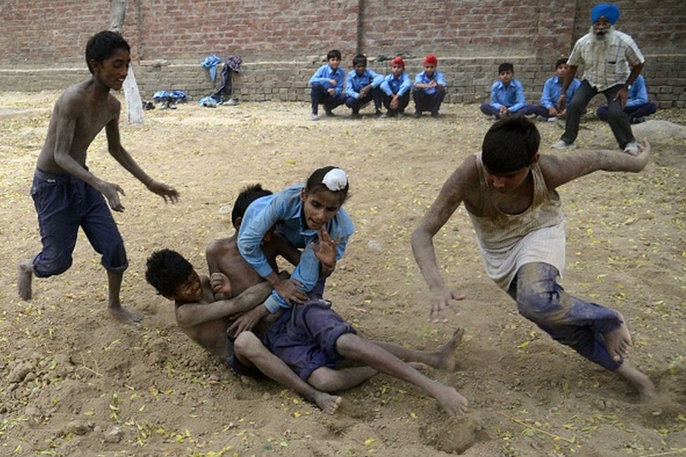 In this photograph taken on October 5, 2016, Indian schoolchildren play Kabaddi at their government school in the village of Sarai Amanat Khan near the Indian Pakistan border, some 30kms west of Amritsar.
