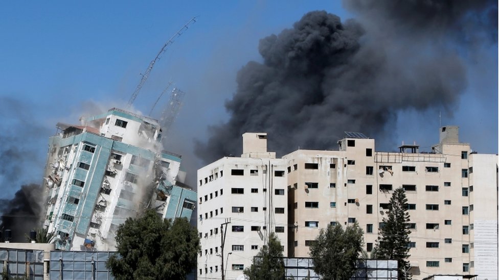 Gaza tower housing media organisations and apartments collapses after a strike in Gaza city, May 15, 2021