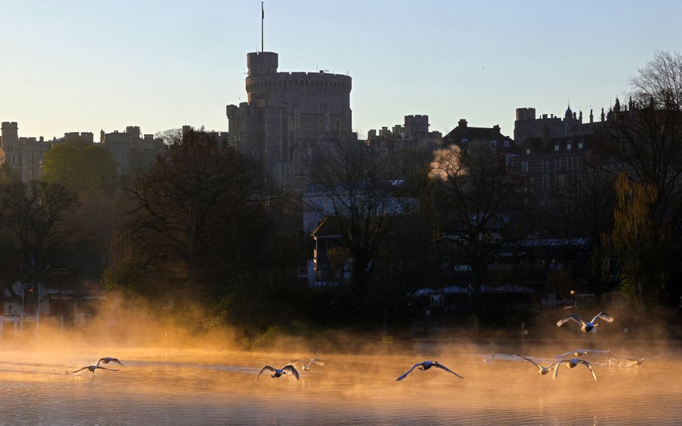 First light rises over Windsor Castle seen from across the River Thames on the Day of Prince Philip, The Duke of Edinburgh's funeral on April 17, 2021 in Windsor, England.