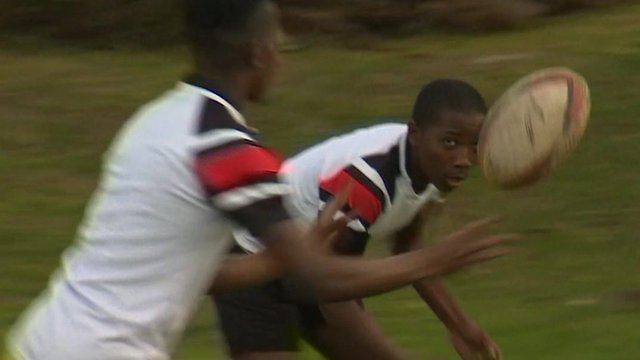 Boys playing rugby