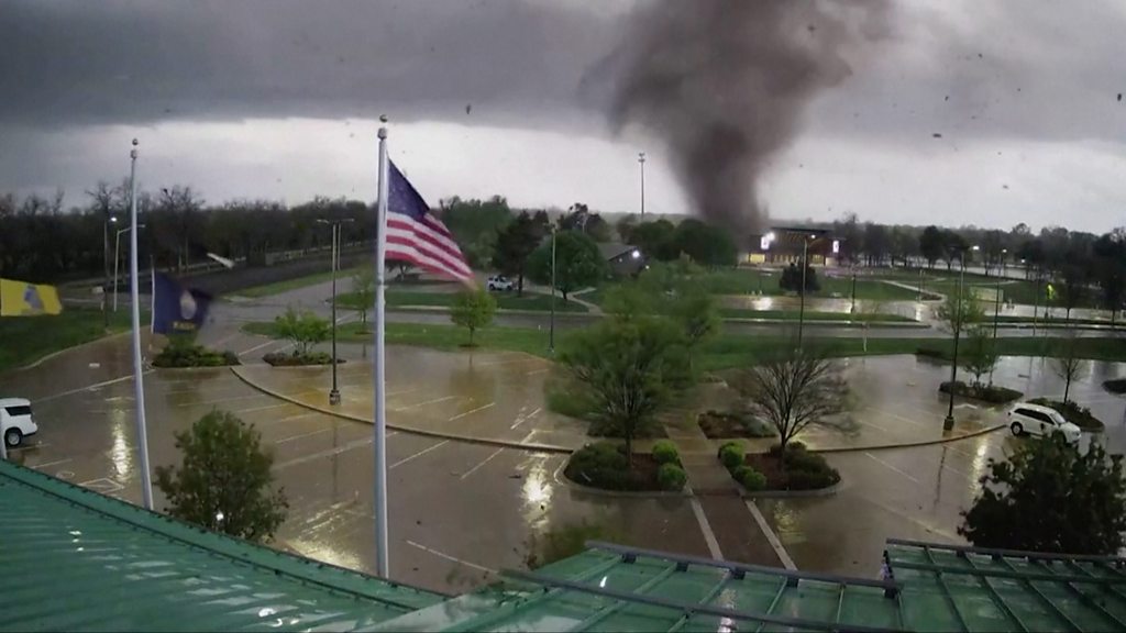 CCTV captures Kansas tornado churning in car park