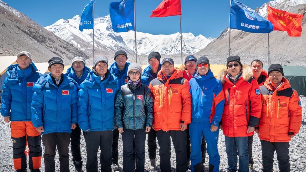 Members of Chinese surveying team pose for photos at Everest Base Camp on May 10, 2020 in Shigatse, Tibet Autonomous Region of China. Image credit - Getty Images