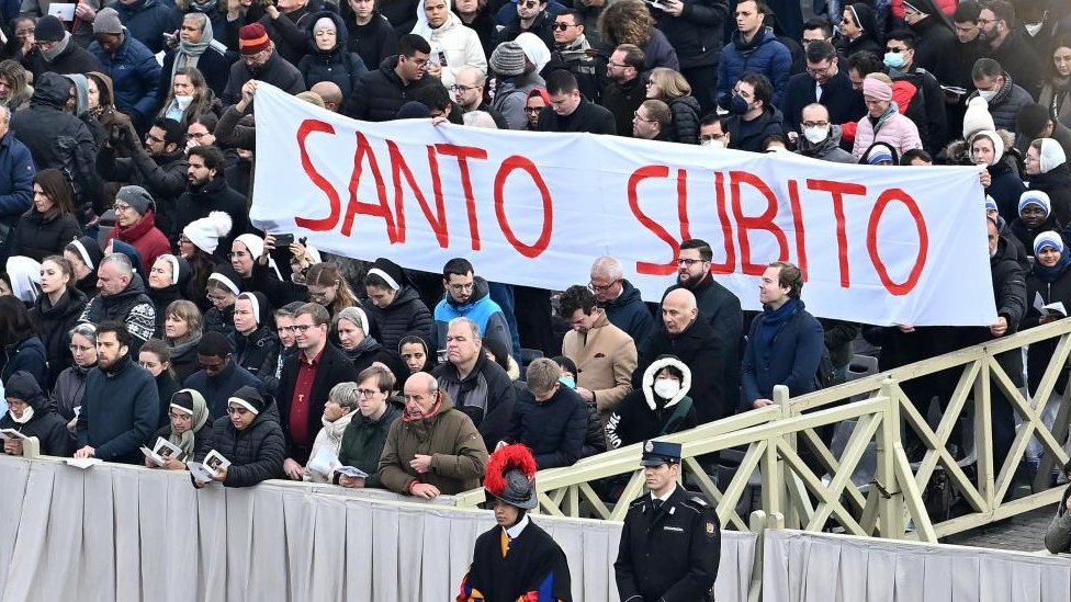 Pilgrims hold a banner during the funeral ceremony of Pope Emeritus Benedict XVI (Joseph Ratzinger) in Saint Peter's Square, in Vatican City, 05 January 2023. Former Pope Benedict XVI died on 31 December 2022 at his Vatican residence, at the age 95.