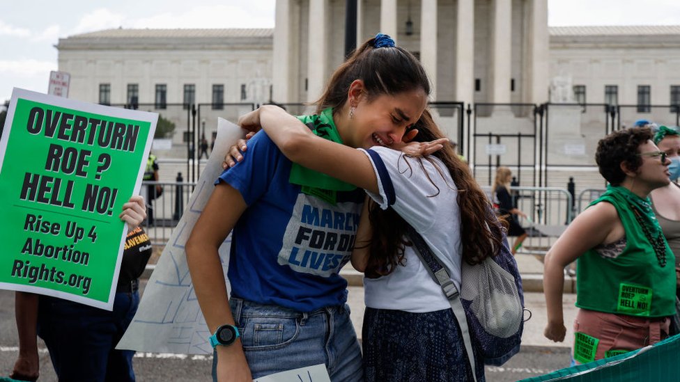 Pro-choice demonstrators cry outside the Supreme Court after Roe was overturned