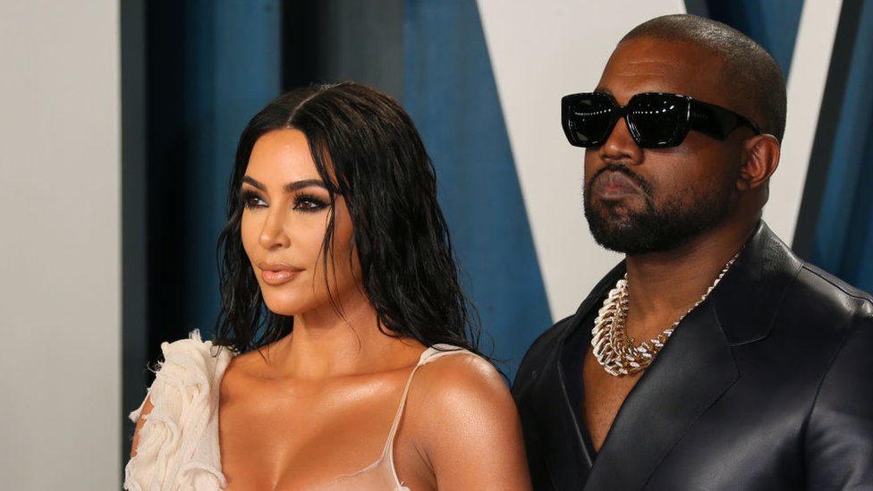 US media personality Kim Kardashian (L) and husband US rapper Kanye West attend the 2020 Vanity Fair Oscar Party