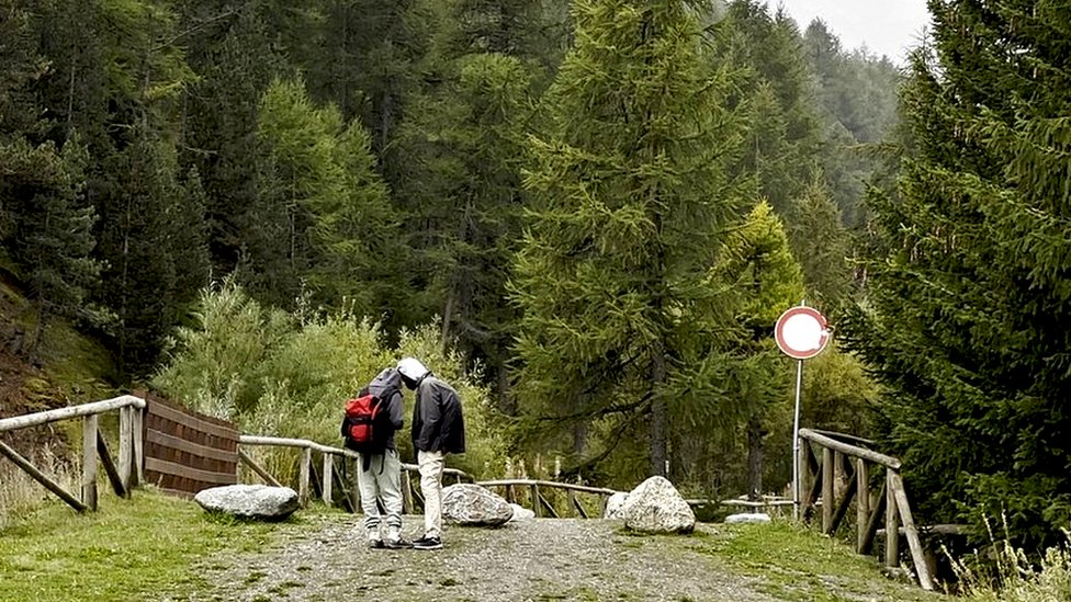 Migrants trying to reach the UK cross the Alps on foot