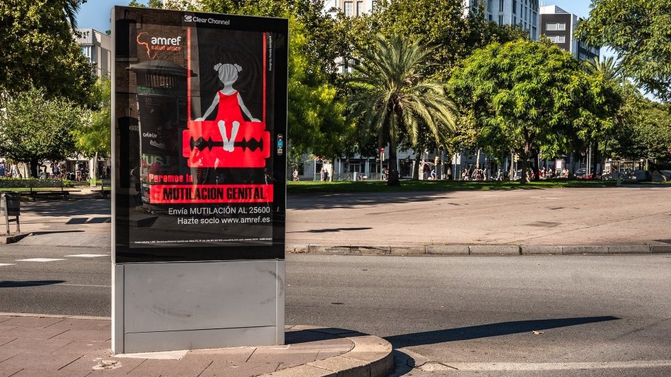 A poster of the campaign against female genital mutilation is seen in Barcelona.
