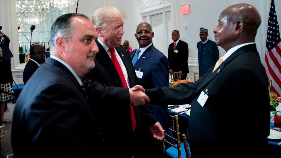 US President Donald Trump (C) greets Uganda's President Yowri Kaguta Museveni (R) before a luncheon with US and African leaders at the Palace Hotel during the 72nd United Nations General Assembly on September 20, 2017