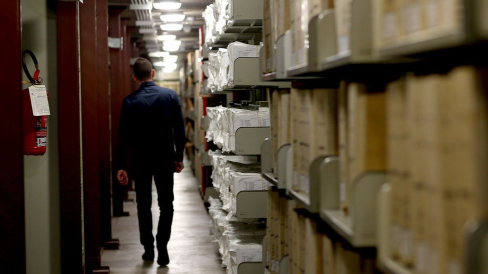 A worker walks through the Vatican Archives.