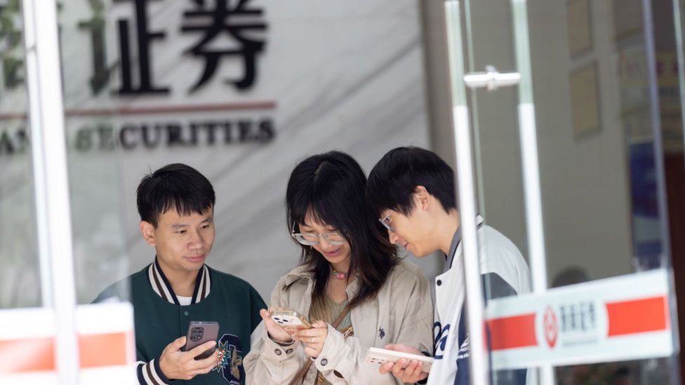 Investors open stock accounts at a stock exchange on October 8, 2024 in Huzhou, Zhejiang Province of China.