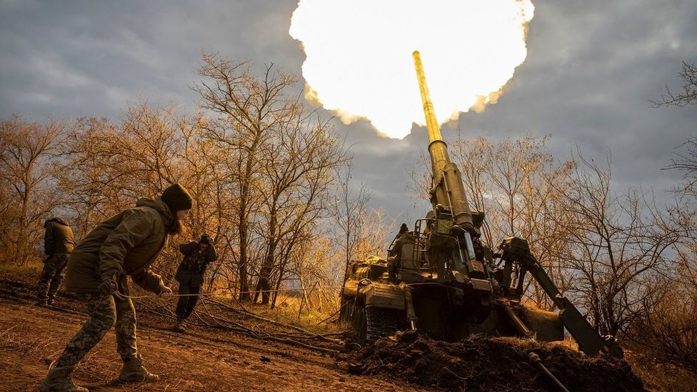 Ukrainian servicemen fire a large self-propelled gun on a front line in Kherson