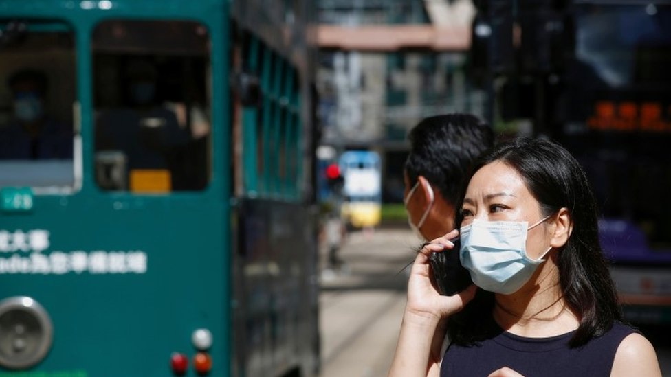 A woman wears a surgical mask following the coronavirus disease (COVID-19) outbreak, in Hong Kong, China July 17, 2020.