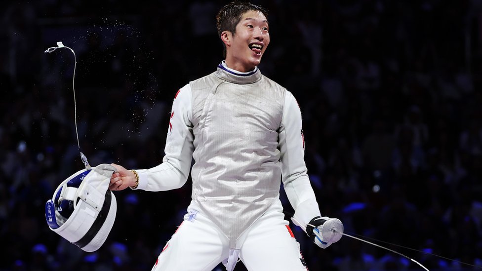 PARIS, FRANCE - JULY 29: Ka Long Cheung of team Hong Kong celebrates winning the Fencing Men's Foil Individual Gold Medal Bout on day three of the Olympic Games Paris 2024 at Grand Palais on July 29, 2024 in Paris, France. (Photo by Al Bello/Getty Images)