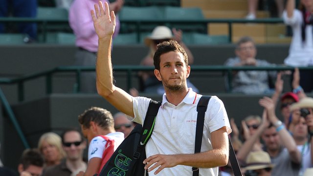 James Ward acknowledges the Wimbledon crowd after his defeat by Vasek Pospisil