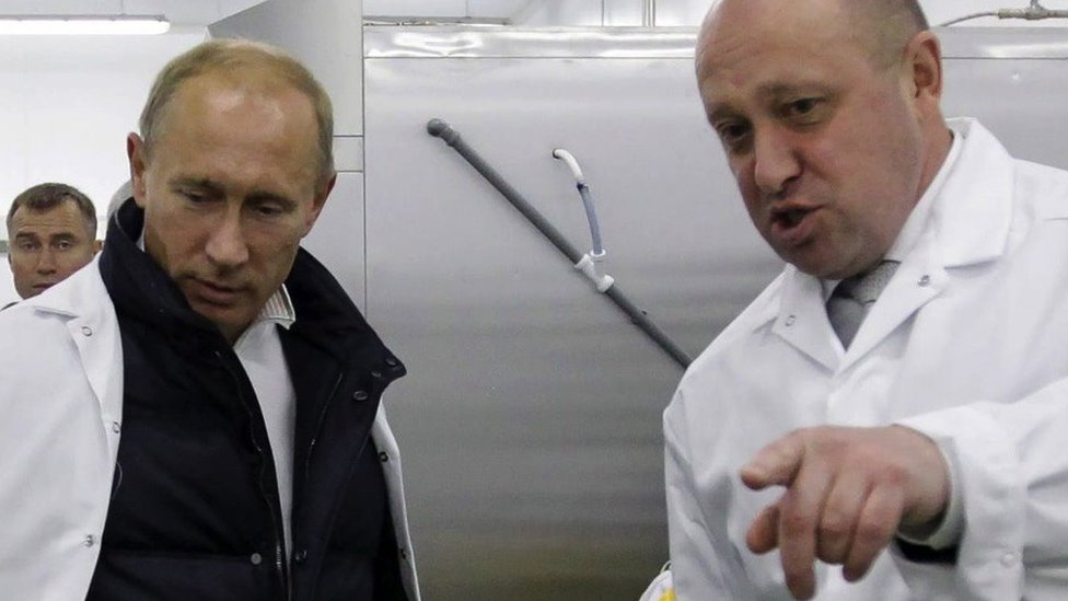 Prigozhin with Putin at a school lunch factory outside Saint Petersburg on 20 September 2010