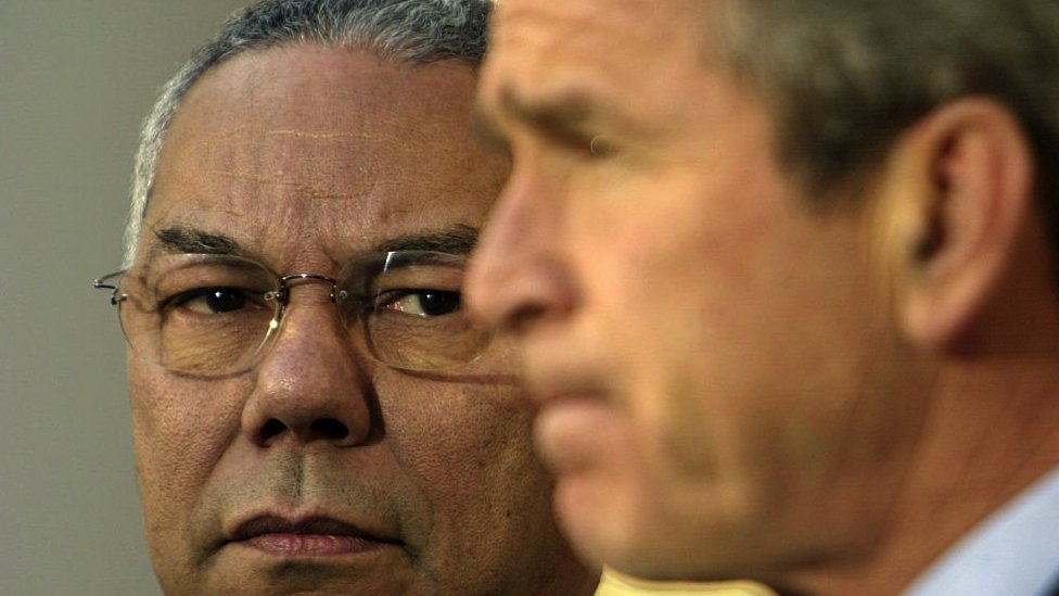 A close-up of Colin Powell (left) and George W. Bush in 2002