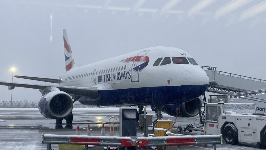 Jersey airport reopens after snow closes runway