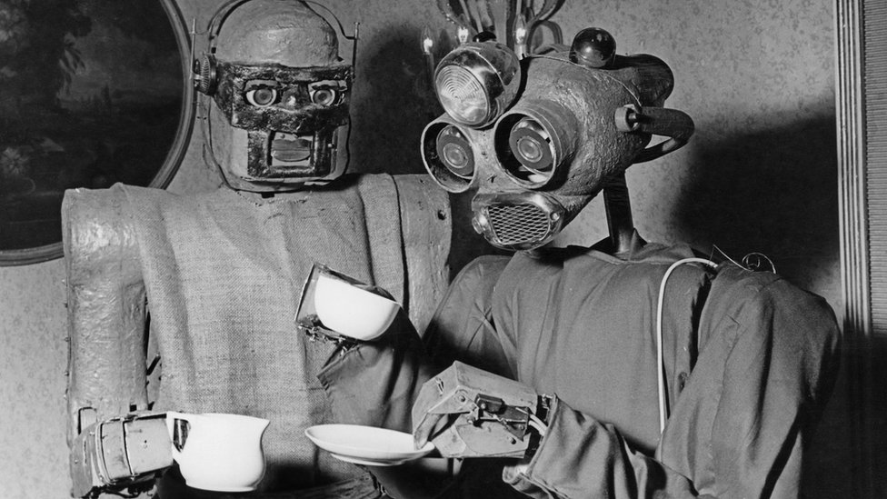 Two robots designed by Viennese artist Claus Scholz 'enjoy' a coffee break in 1964