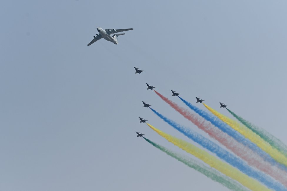 A formation of military aircraft fly over Beijing during the military parade.