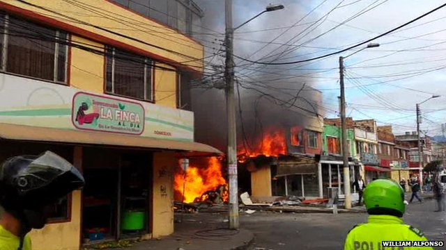 Building on fire after light aircraft crash in Bogota