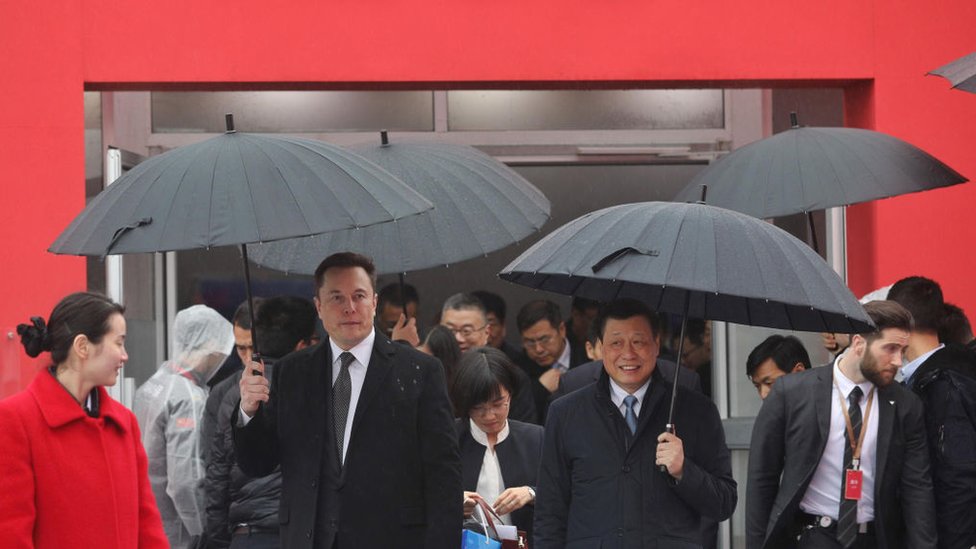 Tesla boss Elon Musk (L) walks with Shanghai Mayor Ying Yong during the ground-breaking ceremony for a Tesla factory in Shanghai on January 7, 2019. - Musk presided over the ground-breaking for a Shanghai factory that will allow the electric-car manufacturer to dodge the China-US tariff crossfire and sell directly to the world's biggest market for "green" vehicles.