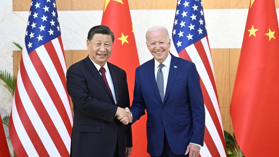 Chinese President Xi Jinping (L) greets his US counterpart Joe Biden before their meeting, one day ahead of the G20 Summit in Bali, Indonesia, 14 November 2022. The 17th Group of Twenty (G20) Heads of State and Government Summit will be held in Bali from 15 to 16 November 2022.