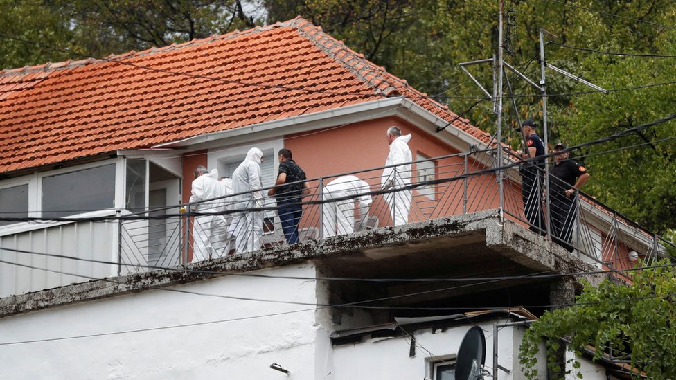 Image shows forensic team inspecting house
